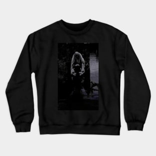 Digital collage, special processing. Strong guy, raised his hands, near big stone. Dark water, mystic. Black and blue, contrast. Crewneck Sweatshirt